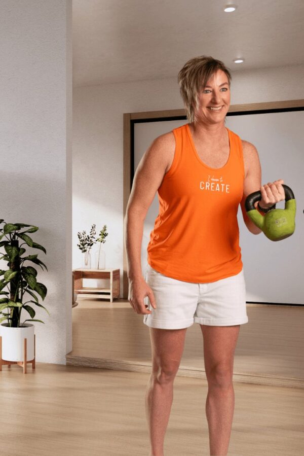 Create | Orange sleeveless activewear top for women - Image 3